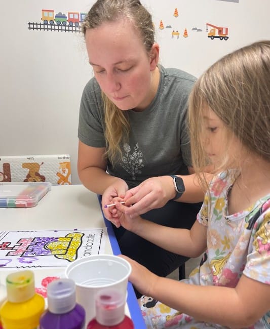 Pediatric OT with therapist and child