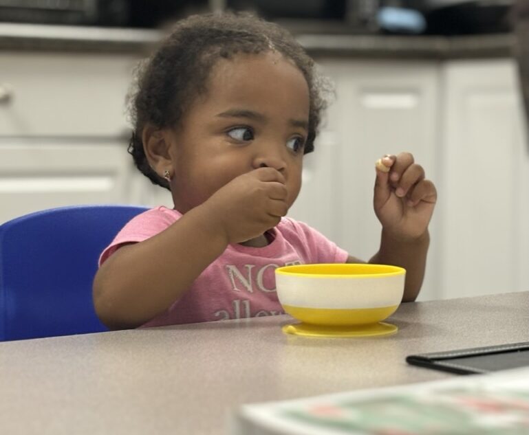 Child eating in feeding therapy